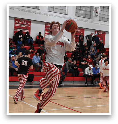 A basketball player leaps in the air to dunk the ball. AI generated content