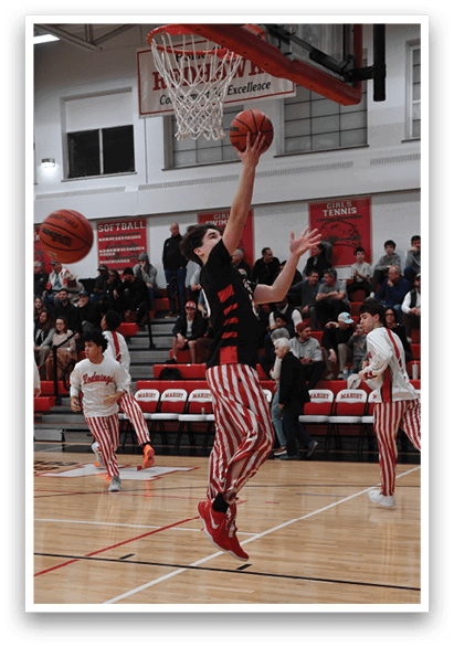 A basketball player in a red and white striped uniform is attempting to dunk a basketball. AI generated content