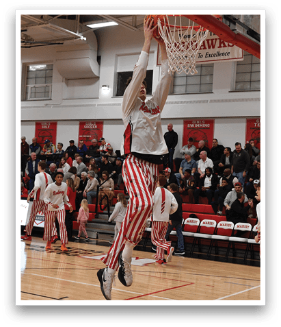 A basketball game is taking place with a player jumping to hit the ball. AI generated content