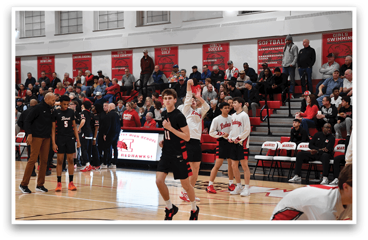 A group of young men playing basketball in a gym. AI generated content