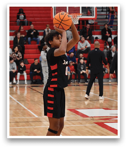 A basketball player is holding a basketball in front of a crowd of people. AI generated content