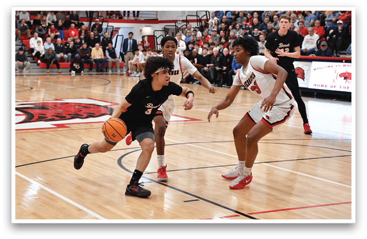 A basketball game is taking place with a group of men playing. One man is holding a basketball and is running towards the basket. The crowd is watching the game intently. AI generated content