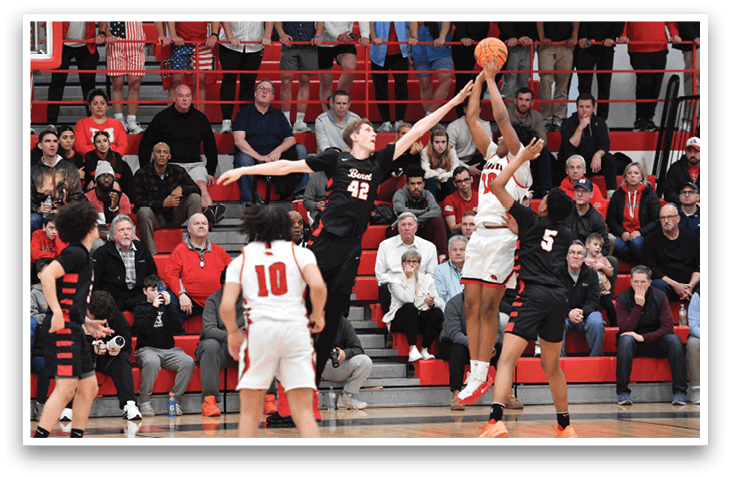 Basketball players on a court with a crowd watching. AI generated content