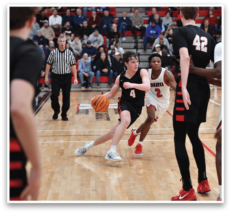 A basketball game is in progress with a player attempting to shoot the ball. AI generated content