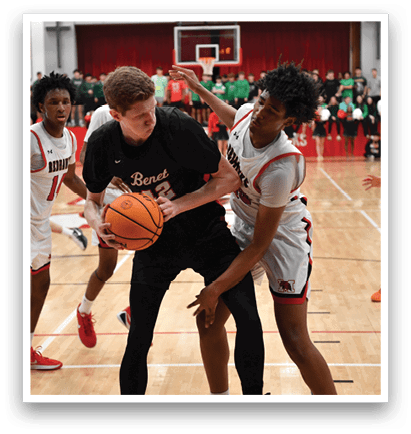 A group of young men playing basketball on a court. AI generated content