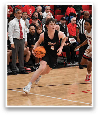 A basketball game is taking place with a player running with a basketball. AI generated content