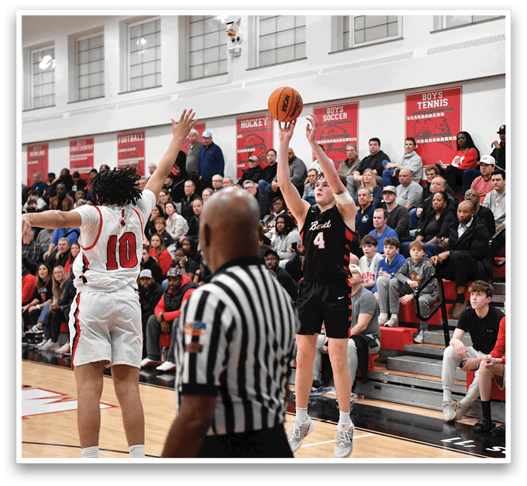 Basketball players on a court, one of them holding a basketball, with a referee and a crowd of people watching. AI generated content