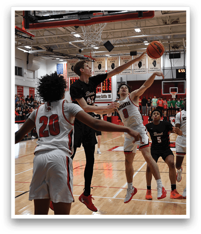 A group of men playing basketball, one of them jumping to block a shot. AI generated content