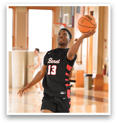 A man wearing a basketball uniform is holding a basketball in a gym. AI generated content