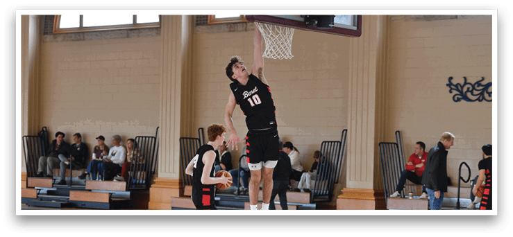 A man is jumping to catch a basketball in a gym. AI generated content