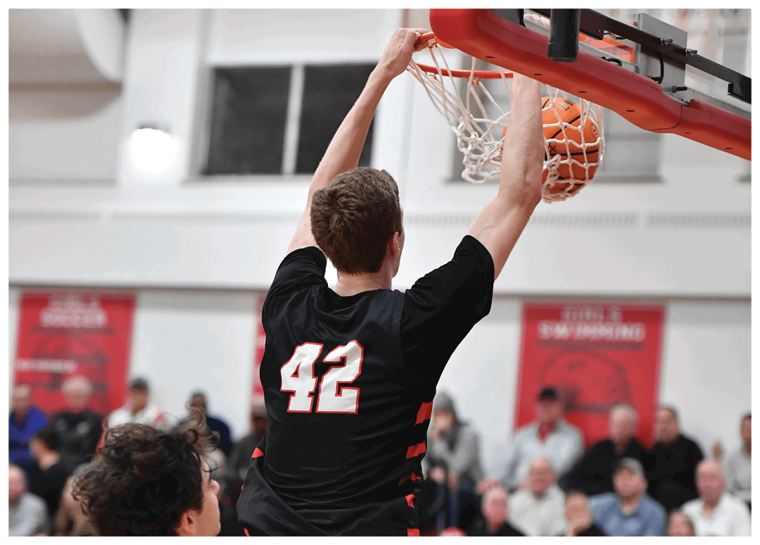 A basketball player is jumping to hit the ball, while the crowd watches. AI generated content