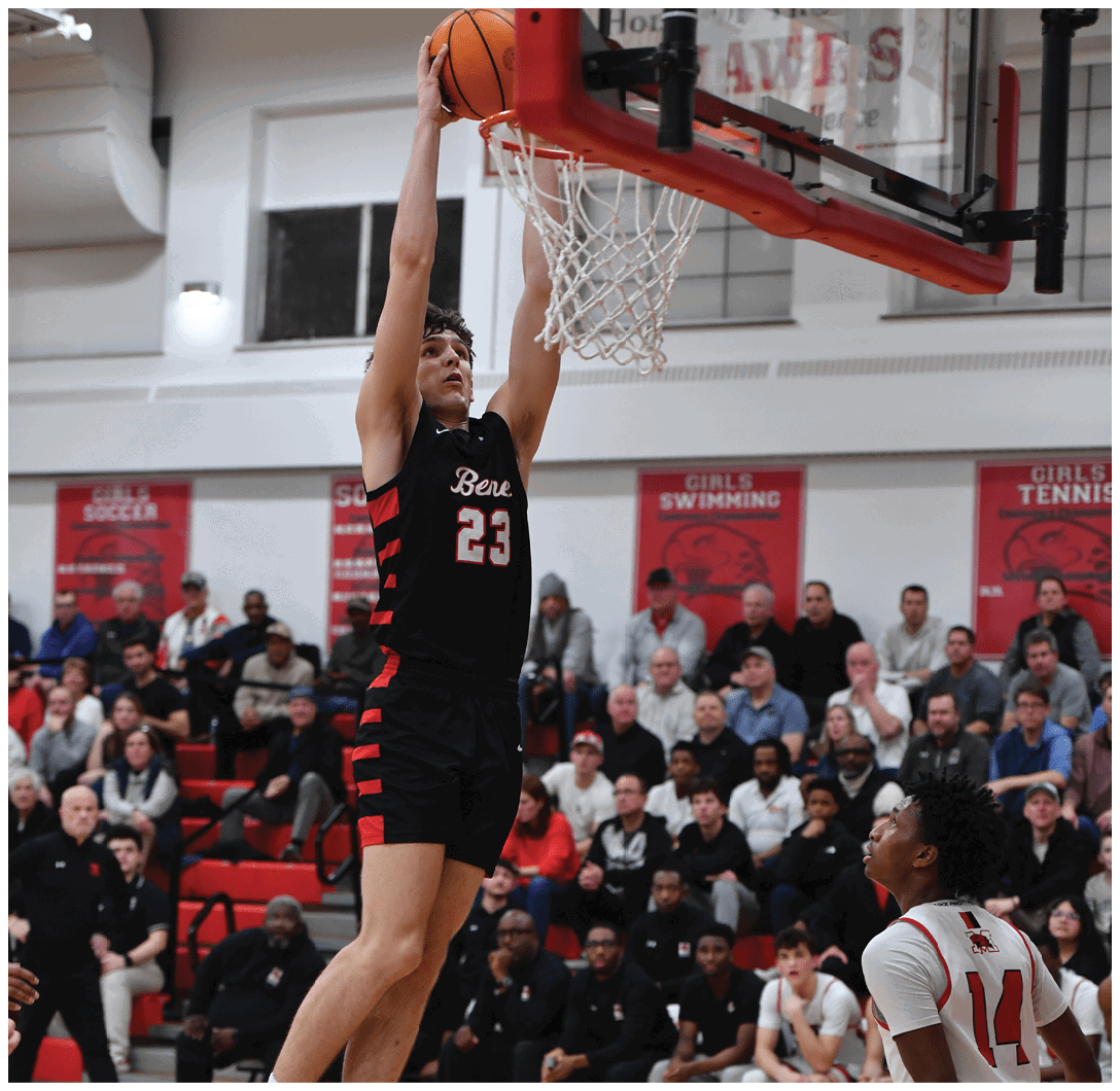 A basketball player leaps into the air to dunk the ball. AI generated content
