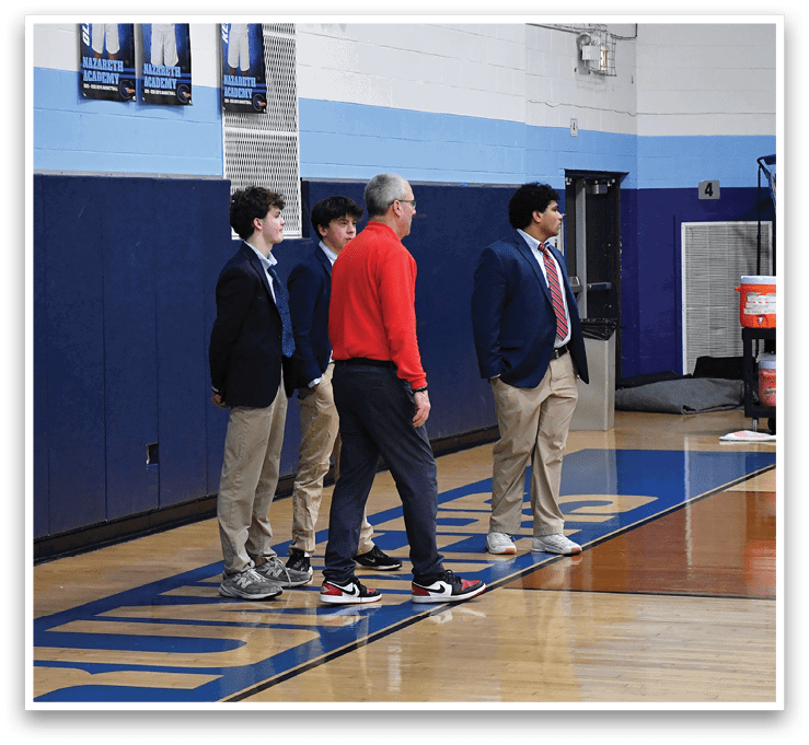 A group of people are standing on a basketball court, one of them is holding a basketball. AI generated content