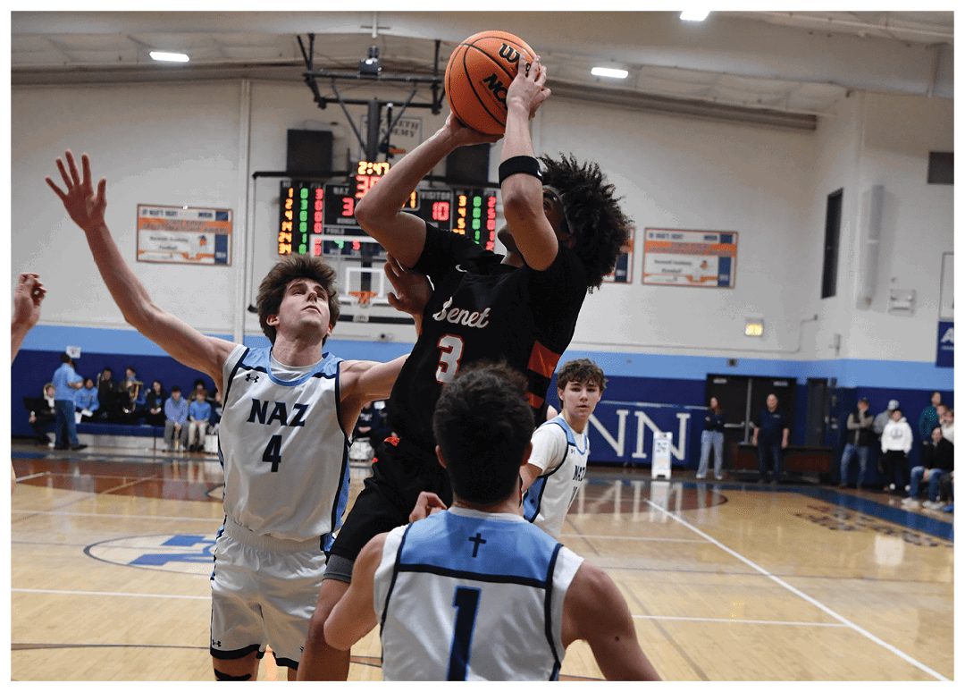 A group of men playing basketball on a court. One man is attempting to block a shot. AI generated content