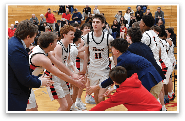 A group of young men in sports uniforms are hugging each other on a basketball court. AI generated content