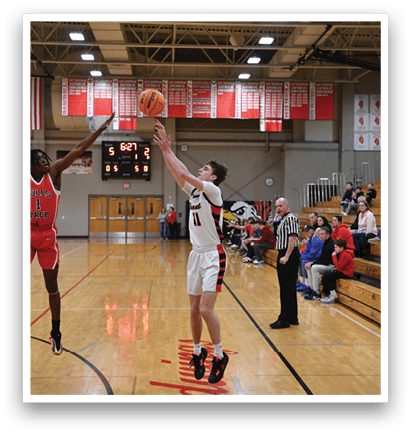 Two basketball players are jumping for the ball, one of them is wearing a red jersey. AI generated content