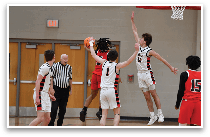 A group of basketball players on a court, one of them jumping to block a shot. AI generated content