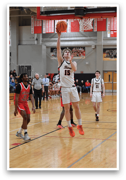 A basketball player is attempting to dunk the ball. AI generated content