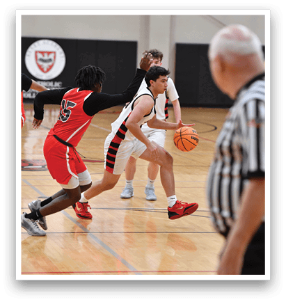 Two men are playing basketball on a court, one of them is wearing a red shirt. AI generated content