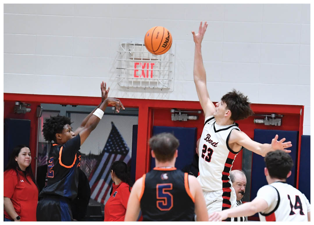 A group of people playing basketball, with one player jumping to block a shot. AI generated content