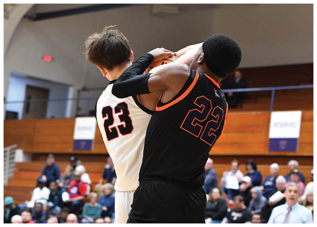 Two men are playing basketball, with one man holding the other in the air. They are both wearing black shorts. AI generated content