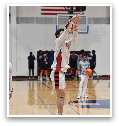 A man is jumping to catch a basketball in a gym. AI generated content