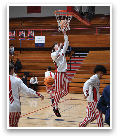 A group of basketball players are playing a game. One player is jumping in the air to hit the basketball. AI generated content