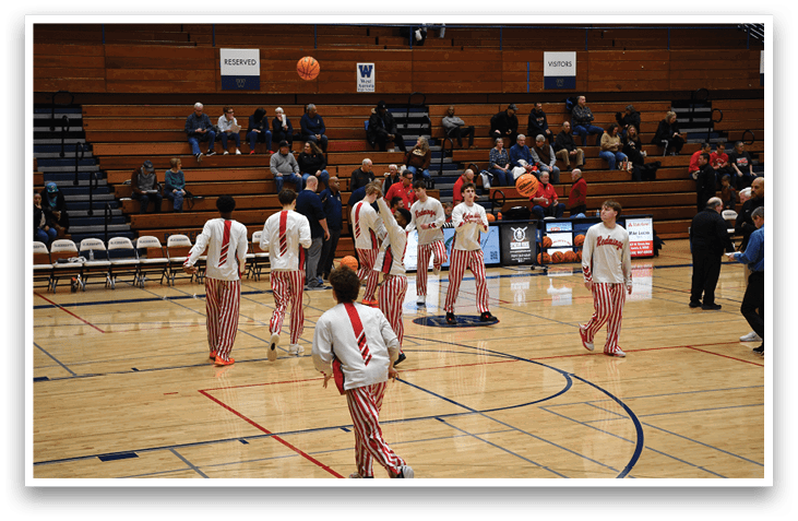 A group of young men playing basketball on a court. AI generated content