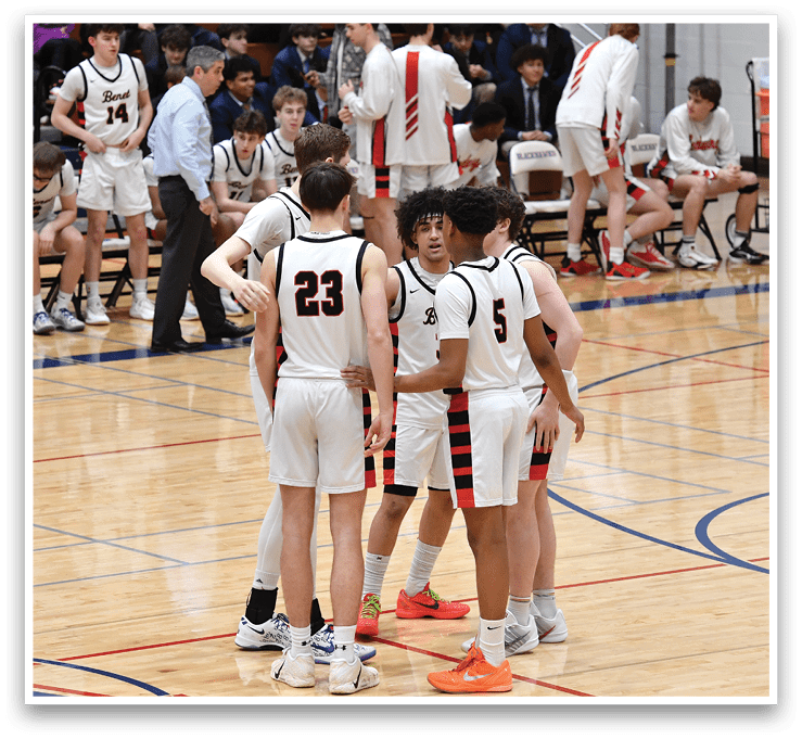 A group of young men are standing on a basketball court, engaged in a conversation. AI generated content
