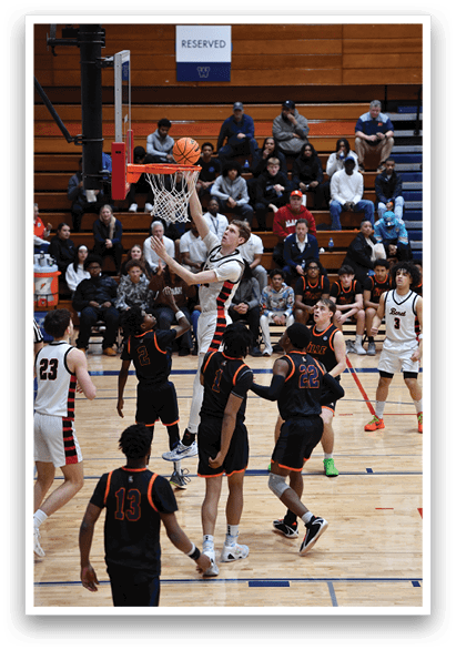 A basketball player is attempting to shoot a basket while being surrounded by other players. AI generated content