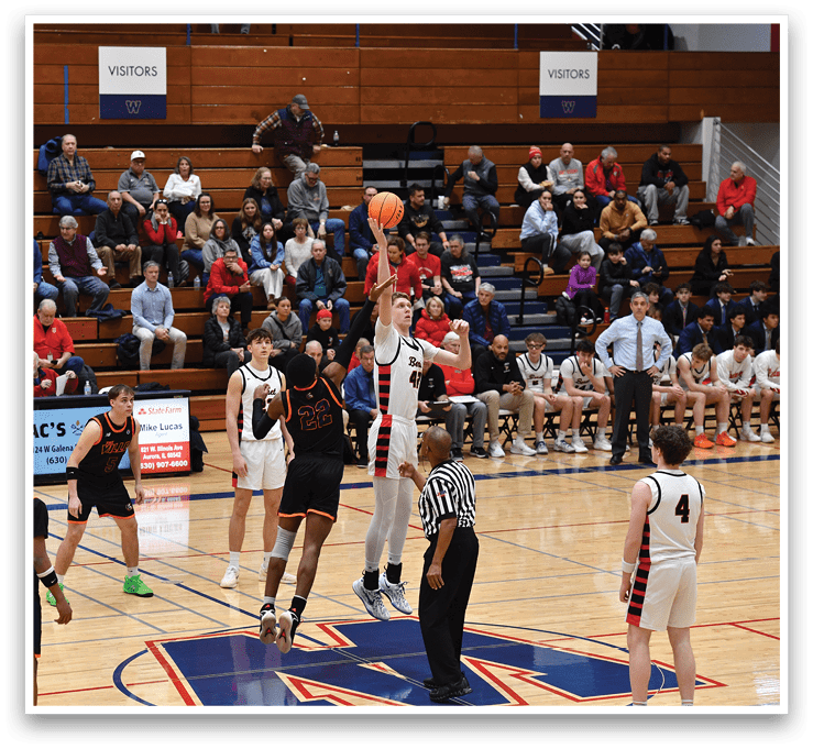 A basketball game is taking place with a player jumping to shoot the ball. The crowd is watching intently as the players compete. AI generated content