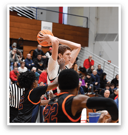 Basketball players on a court with a crowd watching. AI generated content