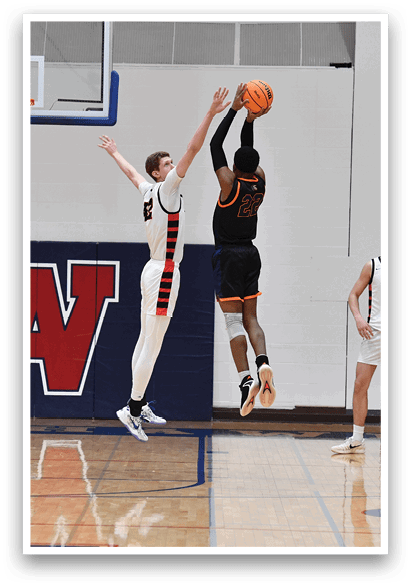 A basketball player leaps to block a shot, while another player attempts to score. AI generated content