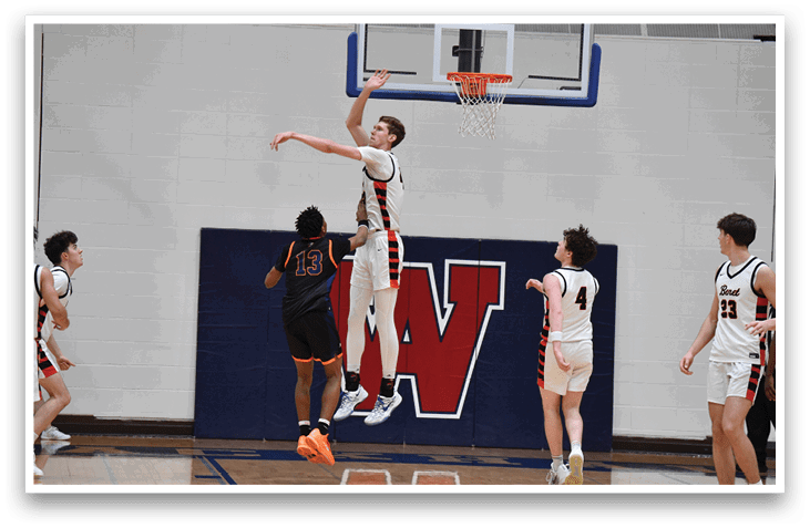 A basketball player is jumping in the air to block a shot. AI generated content