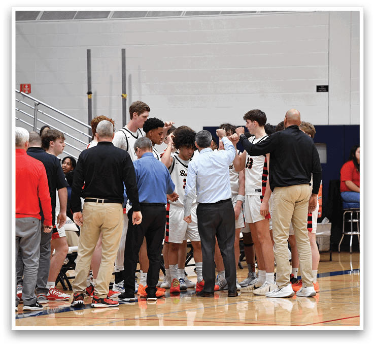 A group of men in basketball uniforms huddle together on the court. AI generated content