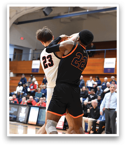 Two men are playing basketball, with one man holding the other in the air. They are both wearing black shorts. AI generated content