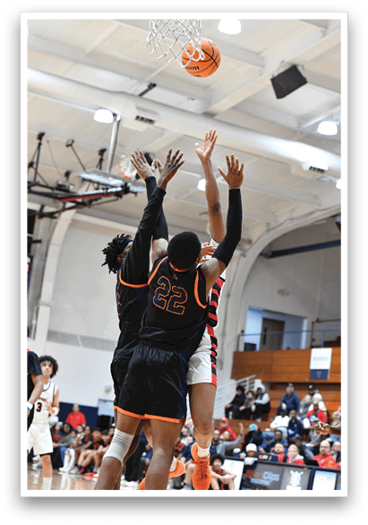 Two basketball players are jumping in the air to reach the ball. AI generated content