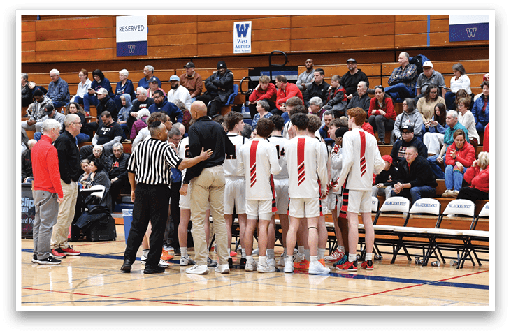 A group of people are standing on a basketball court, with some sitting on chairs. The people are wearing uniforms, and there is a referee present. The scene appears to be a basketball game or practice. AI generated content