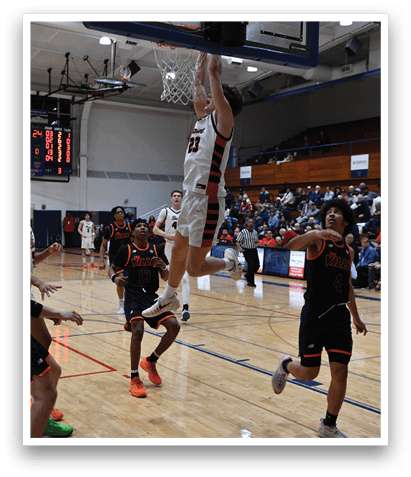 A basketball game is in progress with a player jumping to hit the ball. AI generated content
