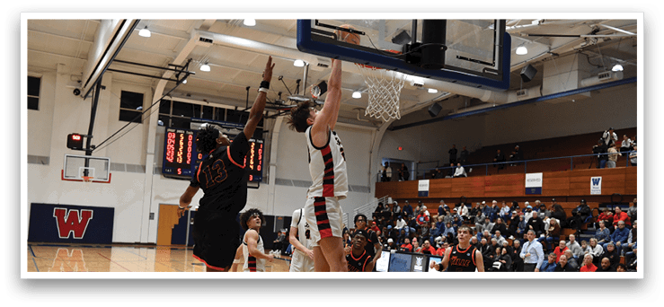 Basketball players jumping for a rebound. AI generated content