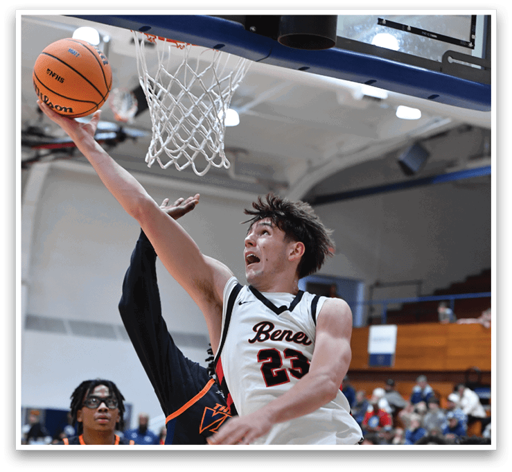 A basketball player is jumping up to block a shot, while other players look on. AI generated content