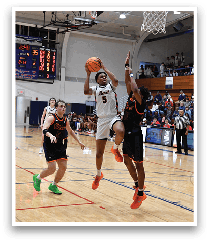 Basketball players on a court, one of them jumping to block a shot. AI generated content