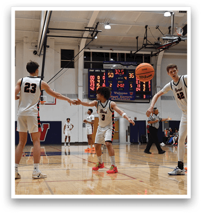 A group of young men playing basketball on a court. AI generated content