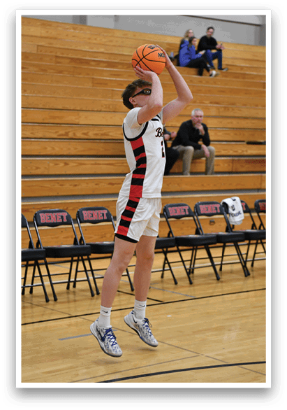 A basketball player is attempting to dunk the ball. AI generated content