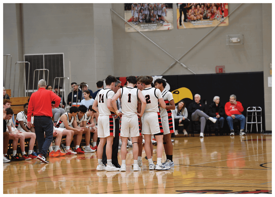 A group of young men are gathered on a basketball court, engaged in a conversation. AI generated content