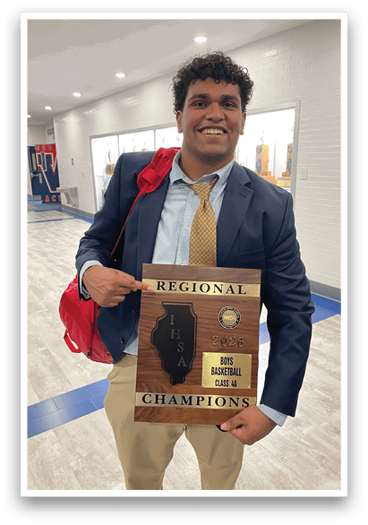 A man in a suit holds a plaque that says “Regional ISA State Basketball Champions." AI generated content