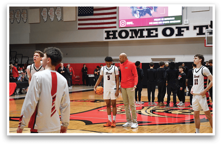 Basketball players on a court with a coach. AI generated content