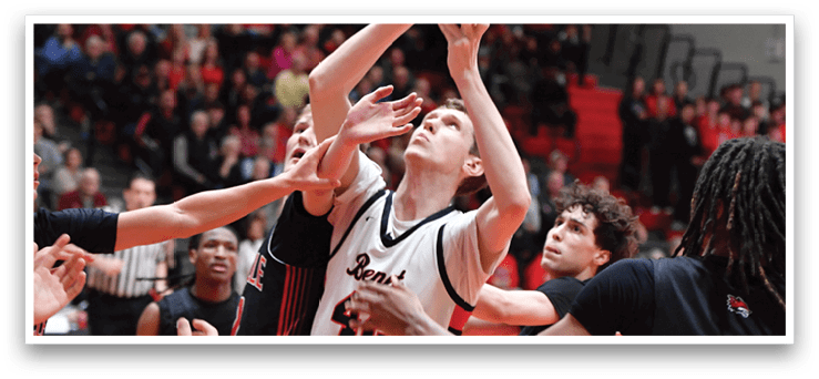 A group of men playing basketball, with one man attempting to block the shot of another player. AI generated content