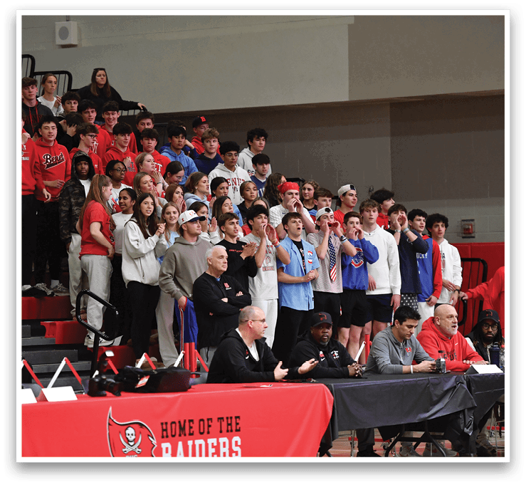 A group of people are sitting in the bleachers, watching a game. AI generated content