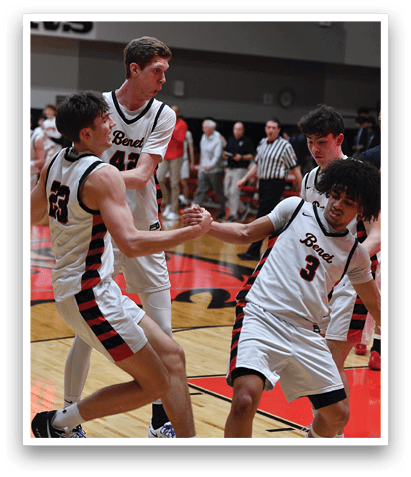 A group of young men are playing basketball on a court. AI generated content